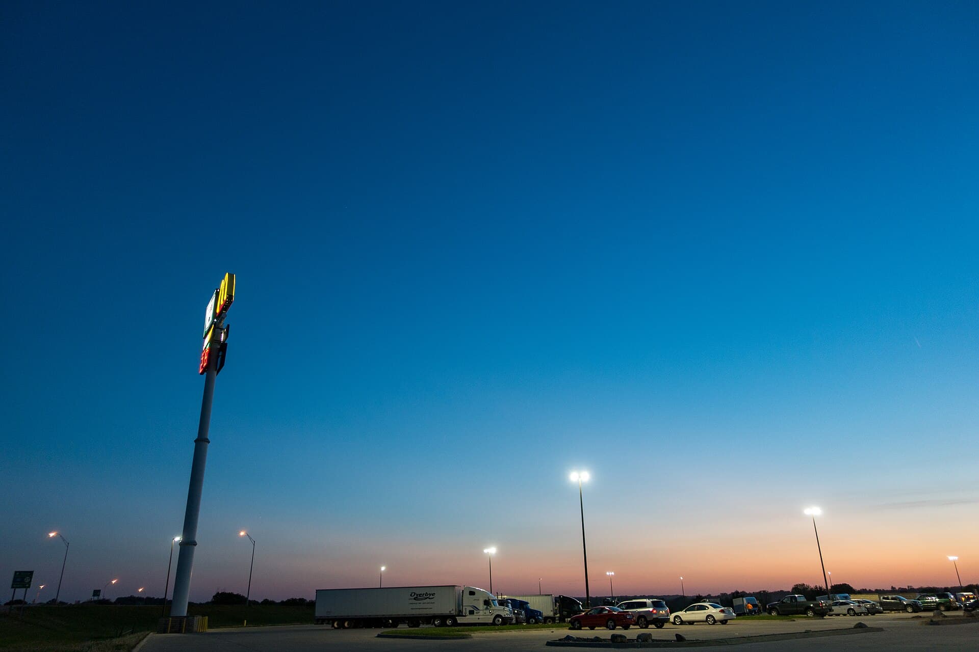 Trucks parked at a depot at dusk
